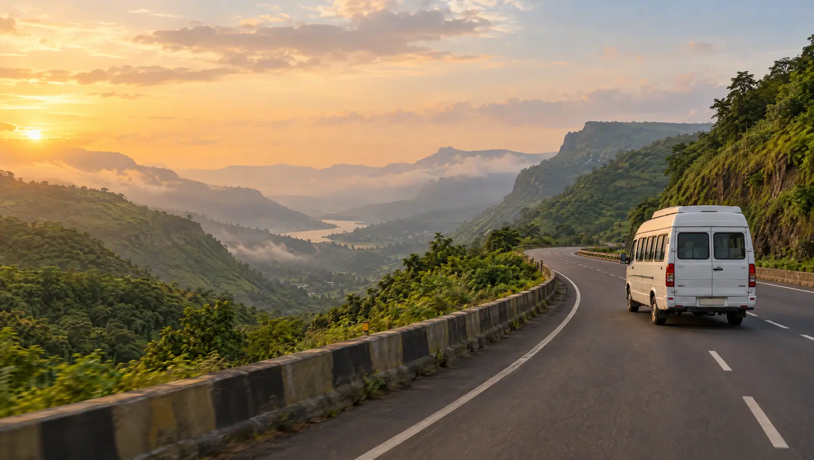A white tempo traveller driving on the Mumbai–Pune Expressway through the green Sahyadri hills near Lonavala at golden hour